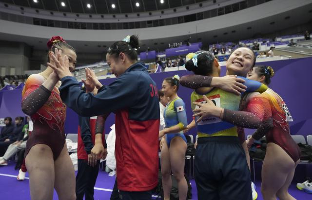 (260923) -- NAGOYA, Sept. 23, 2026 (Xinhua) -- Team China is congratulated by team Japan after the women's team final of Artistic Gymnastics at the 20th Asian Games Aichi-Nagoya 2026 in Nagoya, Japan, Sept. 23, 2026. (Xinhua/Lui Siu Wai)