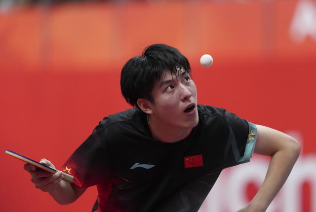 (260923) -- TOYOTA, Sept. 23, 2026 (Xinhua) -- Wen Ruibo of China serves against Kuo Guan-hong of Chinese Taipei during the men's team semifinal match between China and Chinese Taipei at the 20th Asian Games Aichi-Nagoya 2026 in Toyota of Aichi Prefecture, Japan, Sept. 23, 2026. (Xinhua/Cheong Kam Ka)