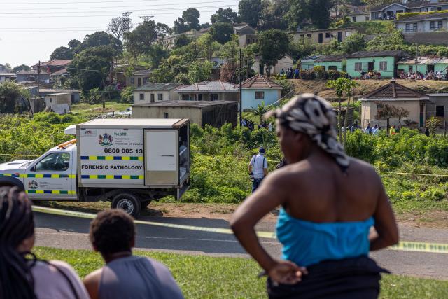 (260923) -- DURBAN, Sept. 23, 2026 (Xinhua) -- People gather at the scene of a shooting incident in KwaMakhutha in KwaZulu-Natal Province, South Africa, Sept. 23, 2026. Eleven people were killed and three others injured in a shooting in KwaMakhutha in South Africa's southeastern KwaZulu-Natal Province, local police said Wednesday.
   According to a statement issued by the South African Police Service (SAPS) in the province, the shooting occurred on Tuesday night in the township's Ziko area. Three men arrived and opened fire on 13 men and a woman believed to be pregnant when they were reportedly having a party inside a house. (Photo by Mbuthi Msweli/Xinhua)