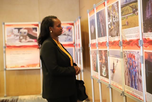 (260923) -- KIGALI, Sept. 23, 2026 (Xinhua) -- A woman visits a news photo exhibition on the theme of China-Rwanda friendship and China's development achievements in Kigali, Rwanda, Sept. 22, 2026. Co-organized by the Chinese Embassy in Rwanda and the Xinhua News Agency Africa Regional Bureau, the exhibition took place on Tuesday during a reception to celebrate the 77th anniversary of the founding of the People's Republic of China and the 55th anniversary of China-Rwanda diplomatic relations.
TO GO WITH "Photo exhibition highlights China-Rwanda friendship, cooperation" (Xinhua/Ju Yinhe)