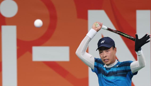 (260923) -- NAGOYA, Sept. 23, 2026 (Xinhua) -- Uematsu Toshiki hits a return during the men's singles final of soft tennis between Uematsu Toshiki of Japan and Kurosaka Takuya of Japan at the 20th Asian Games Aichi-Nagoya 2026 in Nagoya, Japan, Sept. 23, 2026. (Xinhua/Deng Hua)