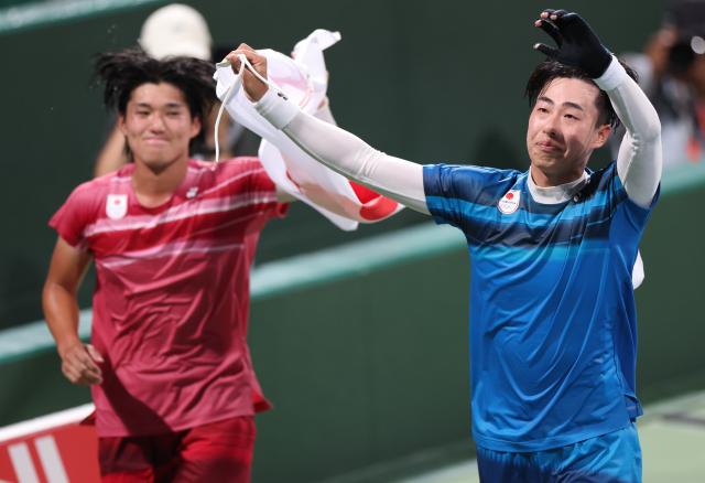 (260923) -- NAGOYA, Sept. 23, 2026 (Xinhua) -- Uematsu Toshiki (R) celebrates after the men's singles final of soft tennis between Uematsu Toshiki of Japan and Kurosaka Takuya of Japan at the 20th Asian Games Aichi-Nagoya 2026 in Nagoya, Japan, Sept. 23, 2026. (Xinhua/Deng Hua)