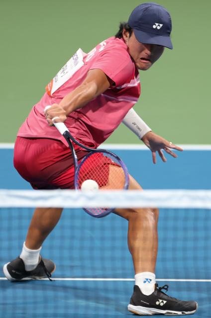 (260923) -- NAGOYA, Sept. 23, 2026 (Xinhua) -- Kurosaka Takuya hits a return during the men's singles final of soft tennis between Uematsu Toshiki of Japan and Kurosaka Takuya of Japan at the 20th Asian Games Aichi-Nagoya 2026 in Nagoya, Japan, Sept. 23, 2026. (Xinhua/Deng Hua)