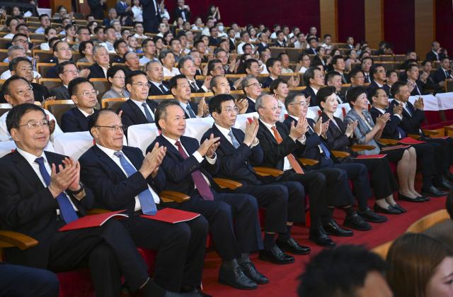 (260923) -- BEIJING, Sept. 23, 2026 (Xinhua) -- Wang Huning, a member of the Standing Committee of the Political Bureau of the Communist Party of China Central Committee and chairman of the Chinese People's Political Consultative Conference National Committee, attends a closing gala of the seventh ethnic minority art festival in Beijing, capital of China, Sept. 23, 2026. The art festival ran from Aug. 18 to Sept. 23. (Xinhua/Zhang Ling)