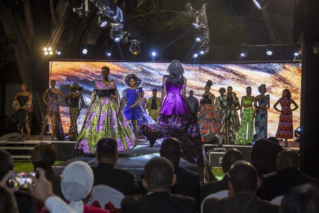(260923) -- LUSAKA, Sept. 23, 2026 (Xinhua) -- Models blending Chinese and Zambian fashion walk the runway during a reception to mark the 77th anniversary of the founding of the People's Republic of China in Lusaka, Zambia, Sept. 22, 2026. The Chinese Embassy in Zambia hosted a reception in Lusaka, the Zambian capital, to celebrate the 77th anniversary of the founding of the People's Republic of China.The event also featured a fashion show highlighting cultural exchanges between the two countries.TO GO WITH "Chinese embassy in Zambia marks 77th founding anniversary of PRC" (Photo by Martin Mbangweta/Xinhua)