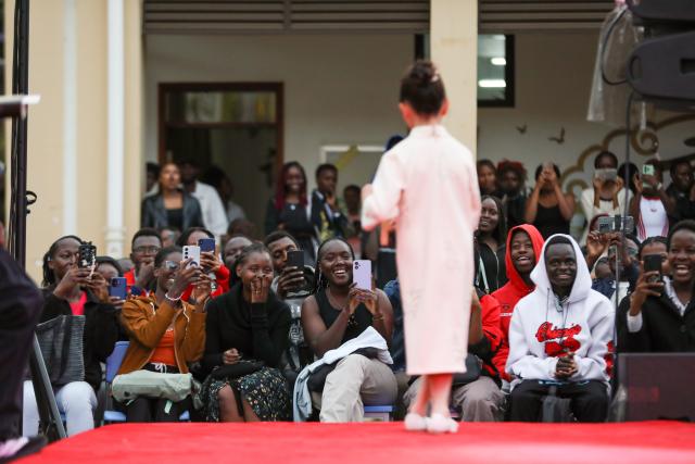 (260923) -- NAIROBI, Sept. 23, 2026 (Xinhua) -- A model interacts with the audience at the China-Africa Cultural Exchange Mid-Autumn Fashion Show in Nairobi, Kenya, Sept. 23, 2026. The China-Africa Cultural Exchange Mid-Autumn Fashion Show was held at the Confucius Institute of the University of Nairobi in Kenya on September 23. (Xinhua/Liu Jiaqi)