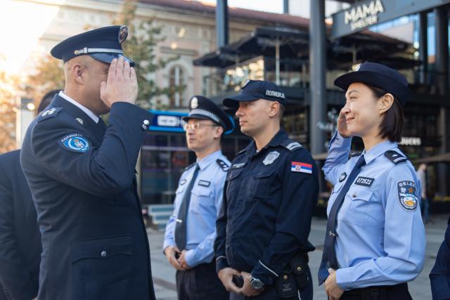 (260924) -- BELGRADE, Sept. 24, 2026 (Xinhua) -- Vladimir Stojanov (L), deputy chief of the Uniformed Police Department of Serbia's Police Directorate, and a Chinese police officer salute each other during the launch ceremony of a joint patrol program in Belgrade, Serbia, Sept. 23, 2026. Chinese and Serbian police officers launched a three-week joint patrol program in downtown Belgrade on Wednesday, aiming at assisting Chinese tourists and residents and strengthening bilateral law enforcement cooperation. (Photo by Wang Wei/Xinhua)