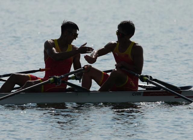 (260924) -- NAGOYA, Sept. 24, 2026 (Xinhua) -- Nie Yide/Yi Xudi (R) of China celebrate after winning the Men's Double Sculls Final A of Rowing at the 20th Asian Games Aichi-Nagoya 2026 in Kaizu of Gifu Prefecture, Japan, Sept. 24, 2026. (Xinhua/Zhou Mi)