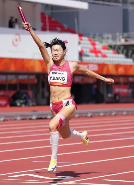 (260924) -- NAGOYA, Sept. 24, 2026 (Xinhua) -- Jiang Yutong of China crosses the finish line during the mixed 4X400m relay heats of Athletics at the 20th Asian Games Aichi-Nagoya 2026 in Nagoya, Japan, Sept. 24, 2026. (Xinhua/Jia Yuchen)