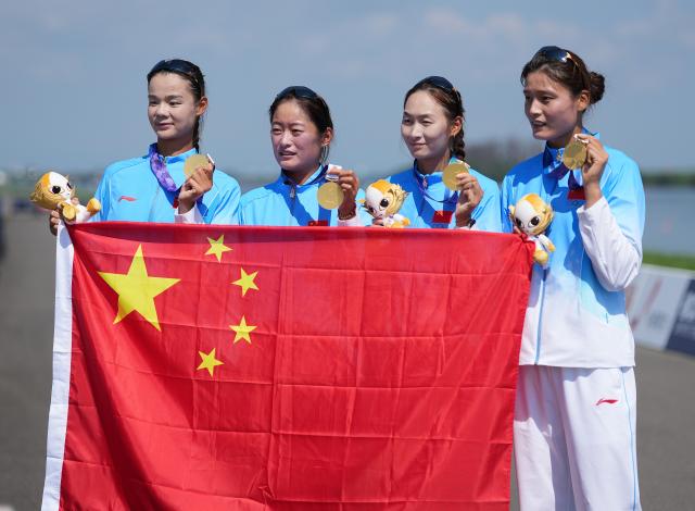 (260924) -- NAGOYA, Sept. 24, 2026 (Xinhua) -- Gold medalists Liu Yaqi, Zhang Yangjing, Li Duolei and Zhang Shuxian (from L to R) pose after the victory ceremony for the Women's Four of Rowing at the 20th Asian Games Aichi-Nagoya 2026 in Kaizu of Gifu Prefecture, Japan, Sept. 24, 2026. (Xinhua/Zhou Mi)