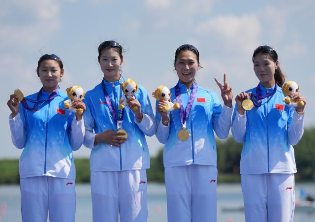(260924) -- NAGOYA, Sept. 24, 2026 (Xinhua) -- Gold medalists Jiao Siyu, Li Yan, Xu Yixi and Han Mengyao (from L to R) pose during the victory ceremony for the Women's Quadruple Sculls of Rowing at the 20th Asian Games Aichi-Nagoya 2026 in Kaizu of Gifu Prefecture, Japan, Sept. 24, 2026. (Xinhua/Zhou Mi)