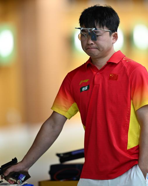 (260924) -- TOYOTA, Sept. 24, 2026 (Xinhua) -- Xie Yu of China reacts during the 10m Air Pistol Men Team Final of shooting at the 20th Asian Games Aichi-Nagoya 2026 in Toyota of Aichi Prefecture, Japan, Sept. 24, 2026. (Xinhua/Liu Lei)