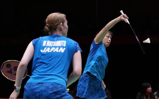 (260924) -- ICHINOMIYA, Sept. 24, 2026 (Xinhua) -- Fukushima Yuki (R)/Matsumoto Mayu of team Japan compete during the doubles match against Liu Shengshu/Tan Ning of team China of the badminton women's team final between China and Japan at the 20th Asian Games Aichi-Nagoya 2026 in Ichinomiya of Aichi Prefecture, Japan, Sept. 24, 2026. (Xinhua/Hou Zhaokang)