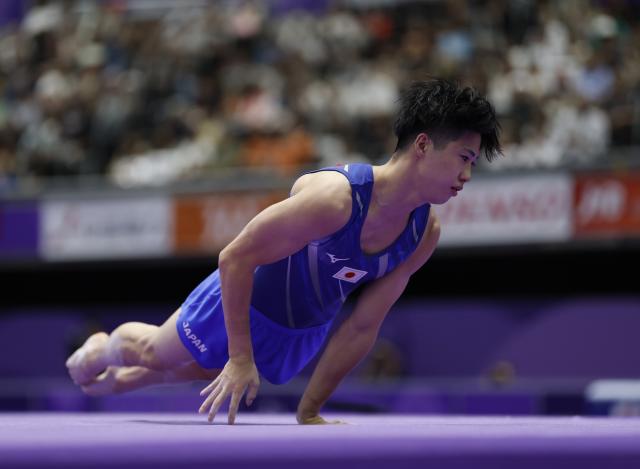 (260924) -- NAGOYA, Sept. 24, 2026 (Xinhua) -- Tsukiyama Shoma of Japan competes during the men's floor exercise final of Artistic Gymnastics at the 20th Asian Games Aichi-Nagoya 2026 in Nagoya, Japan, Sept. 24, 2026. (Xinhua/Wang Lili)