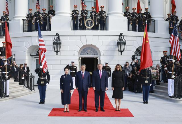 (260924) -- WASHINGTON, Sept. 24, 2026 (Xinhua) -- Chinese President Xi Jinping and his wife Peng Liyuan pose for a group photo with U.S. President Donald Trump and his wife Melania Trump during a welcome ceremony at the White House in Washington, D.C., the United States, Sept. 24, 2026. Trump held a welcome ceremony for Xi, who is on a state visit to the United States, at the White House on Thursday. (Xinhua/Wang Ye)