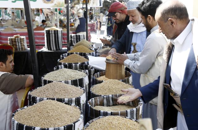 (260924) -- SANAA, Sept. 24, 2026 (Xinhua) -- Visitors shop for local grains from a fair in Sanaa, Yemen, Sept. 24, 2026. A fair named The Fertile Land promoting local grain products was launched in Sanaa recently to foster a culture of reliance on national goods and boost domestic agricultural marketing. (Photo by Mohammed Mohammed/Xinhua)