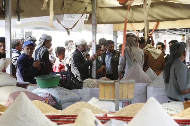 (260924) -- SANAA, Sept. 24, 2026 (Xinhua) -- Visitors shop for local grains from a fair in Sanaa, Yemen, Sept. 24, 2026. A fair named The Fertile Land promoting local grain products was launched in Sanaa recently to foster a culture of reliance on national goods and boost domestic agricultural marketing. (Photo by Mohammed Mohammed/Xinhua)