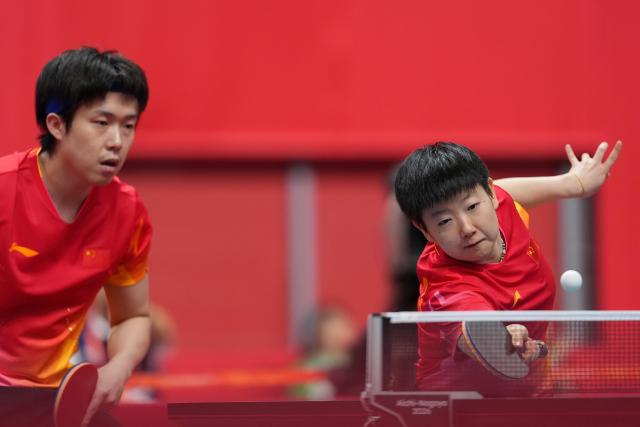 (260925) -- TOYOTA, Sept. 25, 2026 (Xinhua) -- Wang Chuqin/Sun Yingsha (R) compete during the mixed doubles quarterfinals of table tennis between Wang Chuqin/Sun Yingsha of China and Matsushima Sora/Harimoto Miwa of Japan at the 20th Asian Games Aichi-Nagoya 2026 in Toyota of Aichi Prefecture, Japan, Sept. 25, 2026. (Xinhua/Cheong Kam Ka)