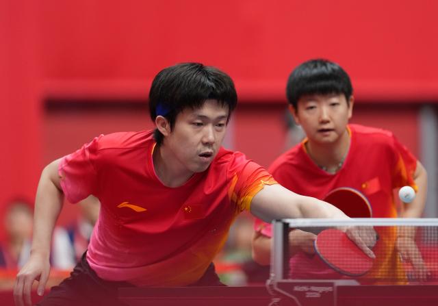 (260925) -- TOYOTA, Sept. 25, 2026 (Xinhua) -- Wang Chuqin (L)/Sun Yingsha of China compete during the mixed doubles quarterfinals of table tennis against Matsushima Sora/Harimoto Miwa of Japan at the 20th Asian Games Aichi-Nagoya 2026 in Toyota of Aichi Prefecture, Japan, Sept. 25, 2026. (Xinhua/Cheong Kam Ka)