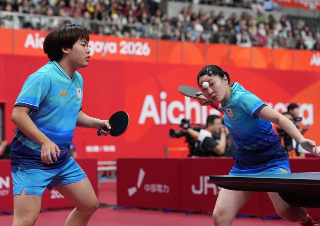 (260925) -- TOYOTA, Sept. 25, 2026 (Xinhua) -- Matsushima Sora/Harimoto Miwa (R) of Japan compete during the mixed doubles quarterfinals of table tennis against Wang Chuqin/Sun Yingsha of China at the 20th Asian Games Aichi-Nagoya 2026 in Toyota of Aichi Prefecture, Japan, Sept. 25, 2026. (Xinhua/Cheong Kam Ka)