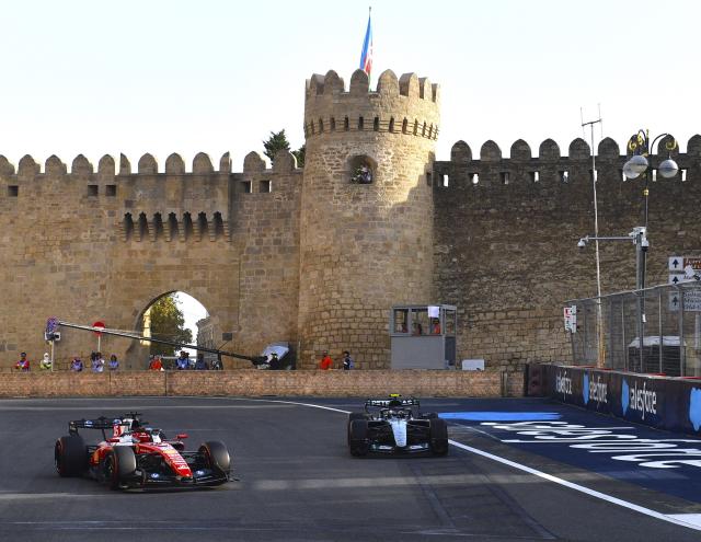 (260925) -- BAKU, Sept. 25, 2026 (Xinhua) -- Ferrari's Charles Leclerc (L) of Monaco and Mercedes' Andrea Kimi Antonelli of Italy compete during the practice session of the Formula One Azerbaijan Grand Prix at the Baku City Circuit in Baku, capital of Azerbaijan, Sept. 24, 2026. (Xinhua/Chen Junfeng)