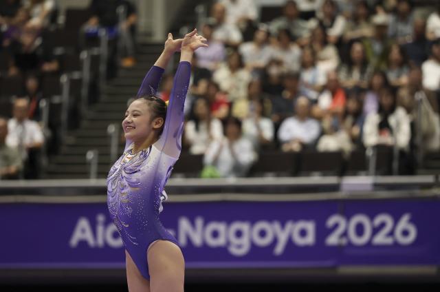 (260925) -- NAGOYA, Sept. 25, 2026 (Xinhua) -- Qiu Qiyuan of China reacts after the women's balance beam final of Artistic Gymnastics at the 20th Asian Games Aichi-Nagoya 2026 in Nagoya, Japan, Sept. 25, 2026. (Xinhua/Xu Yanan)