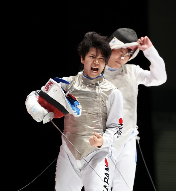 (260925) -- TOKONAME, Sept. 25, 2026 (Xinhua) -- Xu Jie (L) of China reacts after the competition against Baba Shunsuke of Japan during the men's foil team semifinal of Fencing at the 20th Asian Games Aichi-Nagoya 2026 in Tokoname, Aichi Prefecture, Japan, Sept. 25, 2026. (Xinhua/Yao Qilin)