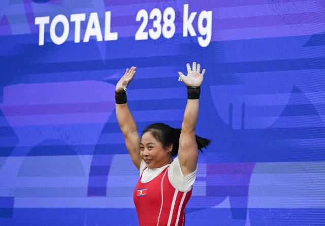 (260925) -- NAGOYA, Sept. 25, 2026 (Xinhua) -- Oh Kwang Ok of the Democratic People's Republic of Korea (DPRK) celebrates during the women's 57kg final of weightlifting at the 20th Asian Games Aichi-Nagoya 2026 in Nagoya, Japan, Sept. 25, 2026. (Xinhua/Yu Yang)