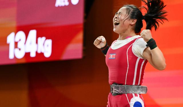 (260925) -- NAGOYA, Sept. 25, 2026 (Xinhua) -- Oh Kwang Ok of the Democratic People's Republic of Korea (DPRK) celebrates during the women's 57kg final of weightlifting at the 20th Asian Games Aichi-Nagoya 2026 in Nagoya, Japan, Sept. 25, 2026. (Xinhua/Yu Yang)