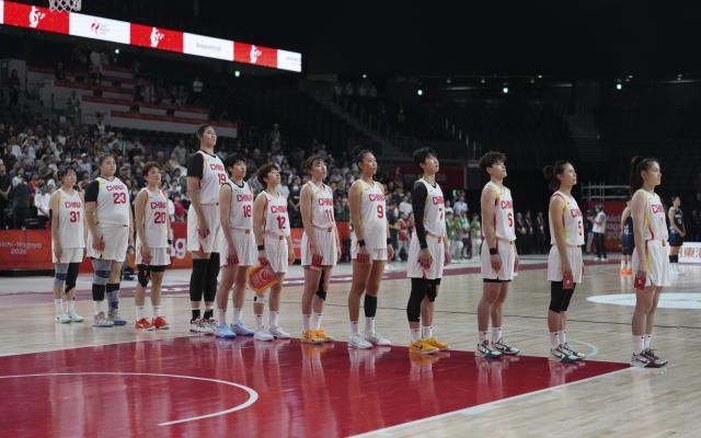 (260925) -- NAGOYA, Sept. 25, 2026 (Xinhua) -- Players of China attend the national flag-raising ceremony ahead of the women's semifinal match between China and South Korea at 20th Asian Games Aichi-Nagoya 2026 in Nagoya, Japan, Sept. 25, 2026. (Xinhua/Zhou Mi)