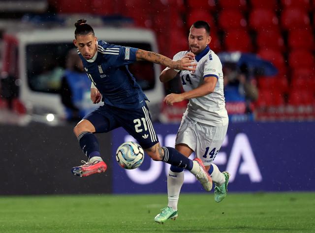 (260925) -- BELGRADE, Sept. 25, 2026 (Xinhua) -- Greece's Kostas Tsimikas (L) vies with Serbia's Andrija Zivkovic (R) during the UEFA Nations League 2026/27 League A football match between Serbia and Greece in Belgrade, Serbia, Sept. 24, 2026. (Photo by Predrag Milosavljevic/Xinhua)