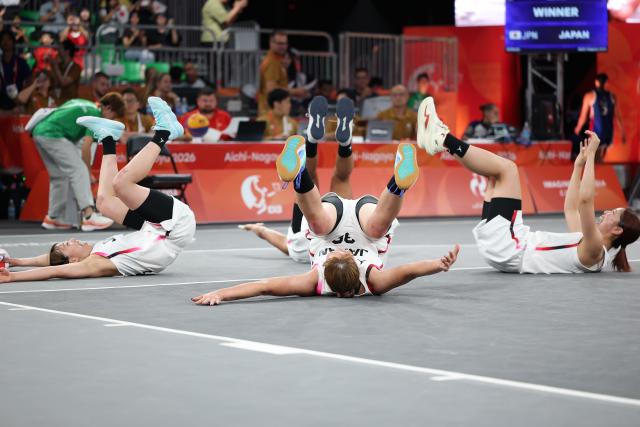 (260925) -- NAGOYA, Sept. 25, 2026 (Xinhua) -- Players of Japan celebrate after the women's final match of 3x3 basketball between Japan and the Philippines at 20th Asian Games Aichi-Nagoya 2026 in Nagoya, Japan, Sept. 25, 2026. (Xinhua/Deng Hua)