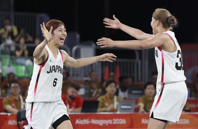 (260925) -- NAGOYA, Sept. 25, 2026 (Xinhua) -- Hirashita Yuki (L) and Yamamoto Haruka of Japan celebrate after the women's final match of 3x3 basketball between Japan and the Philippines at 20th Asian Games Aichi-Nagoya 2026 in Nagoya, Japan, Sept. 25, 2026. (Xinhua/Deng Hua)