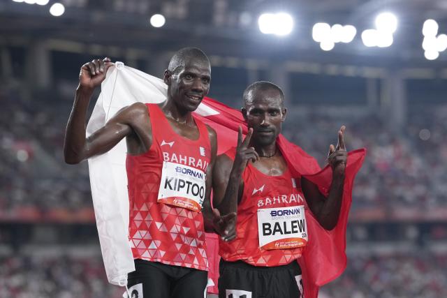 (260925) -- NAGOYA, Sept. 25, 2026 (Xinhua) -- Birhanu Balew (R) and Albert Kiptoo of Bahrain celebrate after the men's 10000m final of athletics at the 20th Asian Games Aichi-Nagoya 2026 in Nagoya, Japan, Sept. 25, 2026. (Xinhua/Lui Siu Wai)