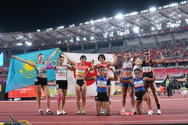 (260925) -- NAGOYA, Sept. 25, 2026 (Xinhua) -- Athletes pose for photos after the women's heptathlon 800m of Athletics at the 20th Asian Games Aichi-Nagoya 2026 in Nagoya, Japan, Sept. 25, 2026. (Xinhua/Lui Siu Wai)