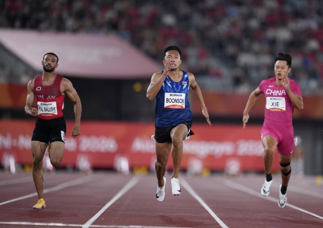 (260925) -- NAGOYA, Sept. 25, 2026 (Xinhua) -- Malham Al Balushi (L) of Oman, Boonson Puripol (C) of Thailand, Xie Zhenye of China compete during the men's 100m final of Athletics at the 20th Asian Games Aichi-Nagoya 2026 in Nagoya, Japan, Sept. 25, 2026. (Xinhua/Lui Siu Wai)