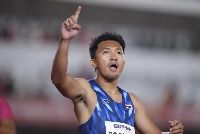 (260925) -- NAGOYA, Sept. 25, 2026 (Xinhua) -- Boonson Puripol of Thailand celebrates after winning the men's 100m final of Athletics at the 20th Asian Games Aichi-Nagoya 2026 in Nagoya, Japan, Sept. 25, 2026. (Xinhua/Jia Yuchen)