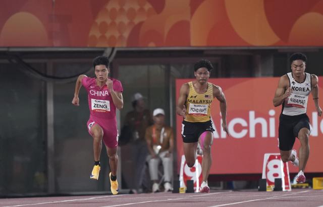 (260925) -- NAGOYA, Sept. 25, 2026 (Xinhua) -- Zeng Keli (L) of China, Muhammad Mohd (C) of Malaysia, Nwamadi Joelijin of South Korea compete during the men's 100m final of Athletics at the 20th Asian Games Aichi-Nagoya 2026 in Nagoya, Japan, Sept. 25, 2026. (Xinhua/Lui Siu Wai)