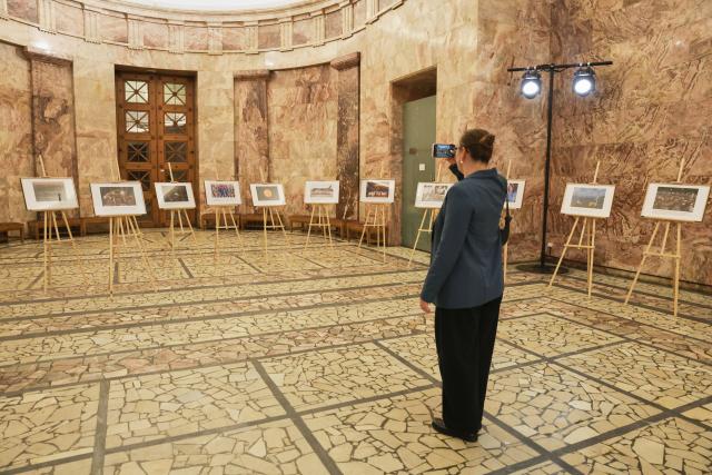 (260925) -- ST. PETERSBURG, Sept. 25, 2026 (Xinhua) -- A woman visits a photo exhibition showcasing the achievements of Chinese modernization, in St. Petersburg, Russia, Sept. 24, 2026. A photo exhibition showcasing the achievements of Chinese modernization was held on Thursday in St. Petersburg, Russia.
  The exhibition featured more than 20 selected Xinhua photographs, highlighting China's development achievements in fields such as the economy, society, culture, and science and technology. (Photo by Irina Motina/Xinhua)
