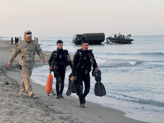 (260925) -- ALMATY, Sept. 25, 2026 (Xinhua) -- This photo provided by the Kazakh Defense Ministry on Sept. 25, 2026 shows people conducting a search and rescue operation at the site of a naval exercise on the Caspian coast in Kazakhstan's southwestern Mangystau region. The search operation for the Kazakh Naval Forces servicemen swept out to sea concluded Friday morning after the bodies of two remaining victims were found, bringing the death toll to 14, the Kazakh Defense Ministry said.
  A total of 17 service members were carried off by waves during a naval exercise on the Caspian coast in Kazakhstan's southwestern Mangystau region amid sharply deteriorating weather conditions, including intensifying winds, the ministry has said in a statement. (Kazakh Defense Ministry/Handout via Xinhua)