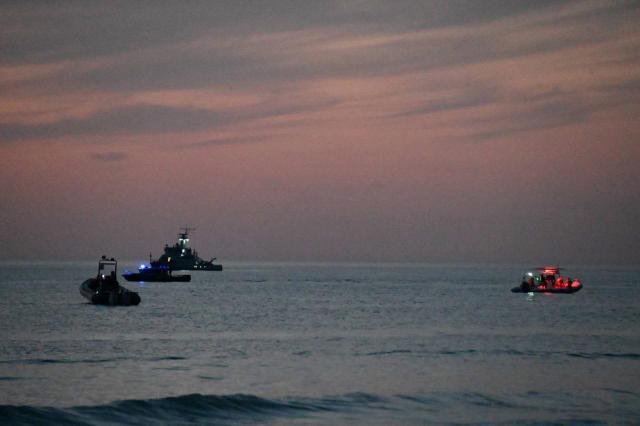 (260925) -- ALMATY, Sept. 25, 2026 (Xinhua) -- This photo provided by the Kazakh Defense Ministry on Sept. 25, 2026 shows people conducting a search and rescue operation at the site of a naval exercise on the Caspian coast in Kazakhstan's southwestern Mangystau region. The search operation for the Kazakh Naval Forces servicemen swept out to sea concluded Friday morning after the bodies of two remaining victims were found, bringing the death toll to 14, the Kazakh Defense Ministry said.
  A total of 17 service members were carried off by waves during a naval exercise on the Caspian coast in Kazakhstan's southwestern Mangystau region amid sharply deteriorating weather conditions, including intensifying winds, the ministry has said in a statement. (Kazakh Defense Ministry/Handout via Xinhua)