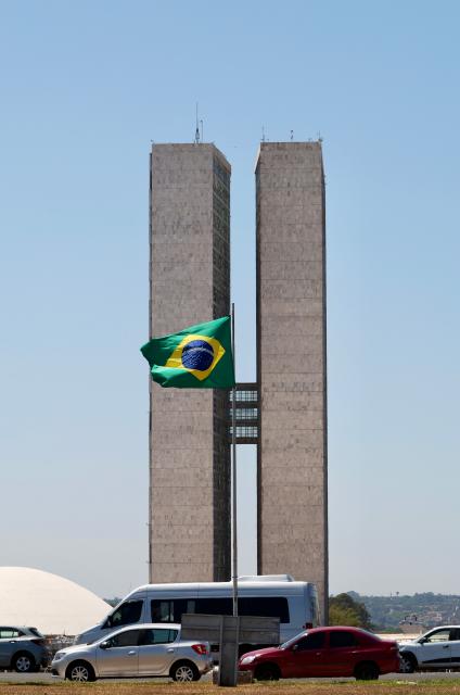 (260925) -- BRASILIA, Sept. 25, 2026 (Xinhua) -- This photo taken on Sept. 24, 2026 shows the Brazilian national flag and the National Congress of Brazil in the background in Brasilia, Brazil. The city of Brasilia, with a population of approximately 3 million, is the capital and the third largest city of Brazil. (Xinhua/Jin Haoyuan)