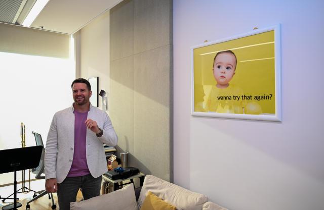 (260926) -- TIANJIN, Sept. 26, 2026 (Xinhua) -- This photo taken on Sept. 15, 2026 shows a photo of Lee Allen's child hanging on the wall of his studio at the Tianjin Juilliard School in Tianjin, north China.
  Lee Allen, a U.S. trombonist, joined the Tianjin Juilliard School as one of its first resident faculty members in 2019. 
  In 2017, while still teaching in the U.S. state of Ohio, Allen led five students on a month-long tour across China, covering 17 cities and staging 19 concerts. This immersive experience gave him deep insight into China's thriving artistic landscape. He noted that the abundance of opportunities, strong institutional support for the arts, and Tianjin's livable urban environment convinced him to build his long-term career here. 
  Over the years, Allen has dedicated himself to nurturing young musical talent, with generations of his students going on to perform on leading international stages. His two children were both born and raised in Tianjin, making the city a true family home. 
  This year, the Tianjin Juilliard School formed its first all-faculty brass quintet, a rare opportunity that allows Allen to perform alongside his peers and deepen his artistic practice. 
  For Allen, music bridges different civilizations, and the Tianjin Juilliard School is a dynamic platform for exchange between Chinese and U.S. arts education. "Teaching is a two-way journey of growth," he said. "While I guide my students, they also teach me every day." (Xinhua/Sun Fanyue)