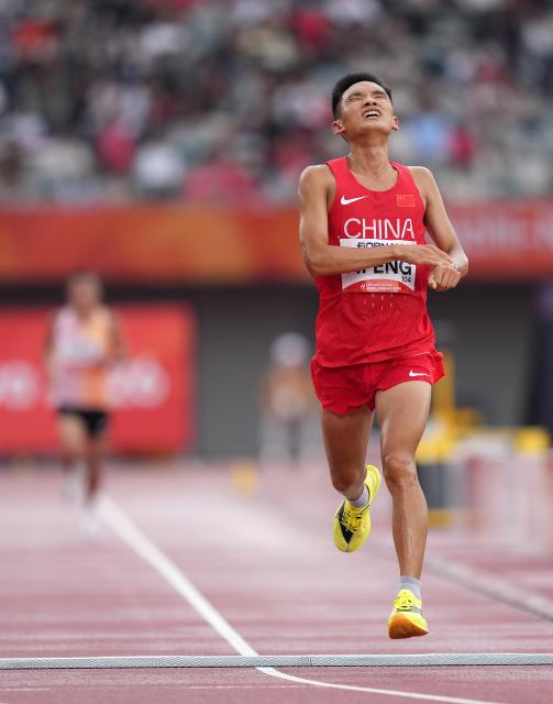 (260926) -- NAGOYA, Sept. 26, 2026 (Xinhua) -- Feng Peiyou of China crosses the finish line during the men's marathon final of athletics at the 20th Asian Games Aichi-Nagoya 2026 in Nagoya, Japan, Sept. 26, 2026. (Xinhua/Lui Siu Wai)