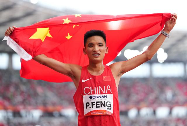 (260926) -- NAGOYA, Sept. 26, 2026 (Xinhua) -- Feng Peiyou of China celebrates after the men's marathon final of Athletics at the 20th Asian Games Aichi-Nagoya 2026 in Nagoya, Japan, Sept. 26, 2026. (Xinhua/Lui Siu Wai)