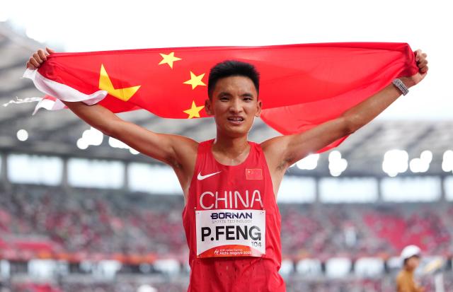 (260926) -- NAGOYA, Sept. 26, 2026 (Xinhua) -- Feng Peiyou of China celebrates after the men's marathon final of Athletics at the 20th Asian Games Aichi-Nagoya 2026 in Nagoya, Japan, Sept. 26, 2026. (Xinhua/Lui Siu Wai)