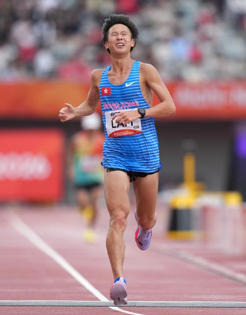 (260926) -- NAGOYA, Sept. 26, 2026 (Xinhua) -- Lam Vincent Leslie of China's Hong Kong crosses the finish line during the men's marathon final of Athletics at the 20th Asian Games Aichi-Nagoya 2026 in Nagoya, Japan, Sept. 26, 2026. (Xinhua/Lui Siu Wai)