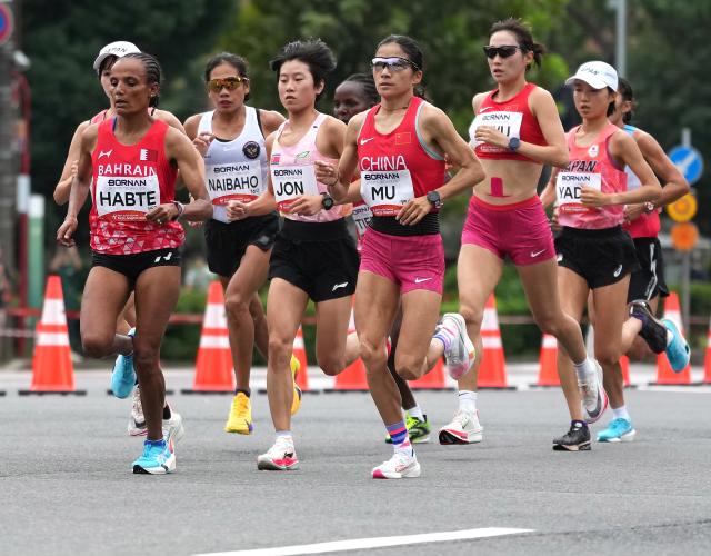 (260926) -- NAGOYA, Sept. 26, 2026 (Xinhua) -- Athletes compete during the women's marathon final of Athletics at the 20th Asian Games Aichi-Nagoya 2026 in Nagoya, Japan, Sept. 26, 2026. (Xinhua/Jia Yuchen)