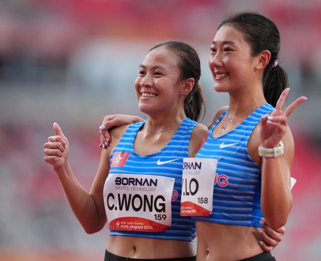 (260926) -- NAGOYA, Sept. 26, 2026 (Xinhua) -- Lo Ying Chiu (R) and Wong Cheuk Ning of Hong Kong, China pose after the women's marathon final of athletics at the 20th Asian Games Aichi-Nagoya 2026 in Nagoya, Japan, Sept. 26, 2026. (Xinhua/Lui Siu Wai)