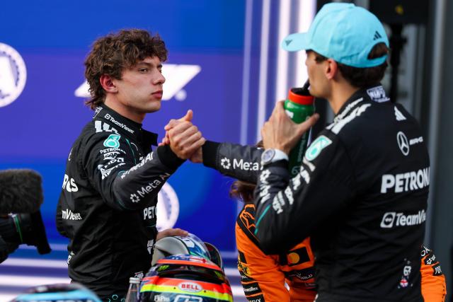 (260926) -- BAKU, Sept. 26, 2026 (Xinhua) -- Mercedes' driver Kimi Antonelli (L) of Italy congrats his teammate George Russell of Britain for the pole position after the qualifying session of the Formula One Azerbaijan Grand Prix at the Baku City Circuit in Baku, Azerbaijan, Sept. 25, 2026. (Photo by Qian Jun/Xinhua)
